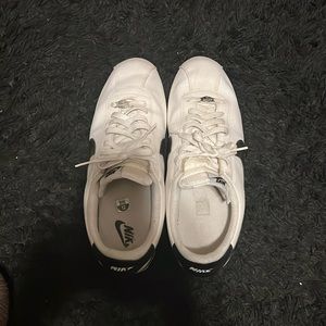 Gentle used Nike Cortez men size 12. Good condition. White with black swoop.